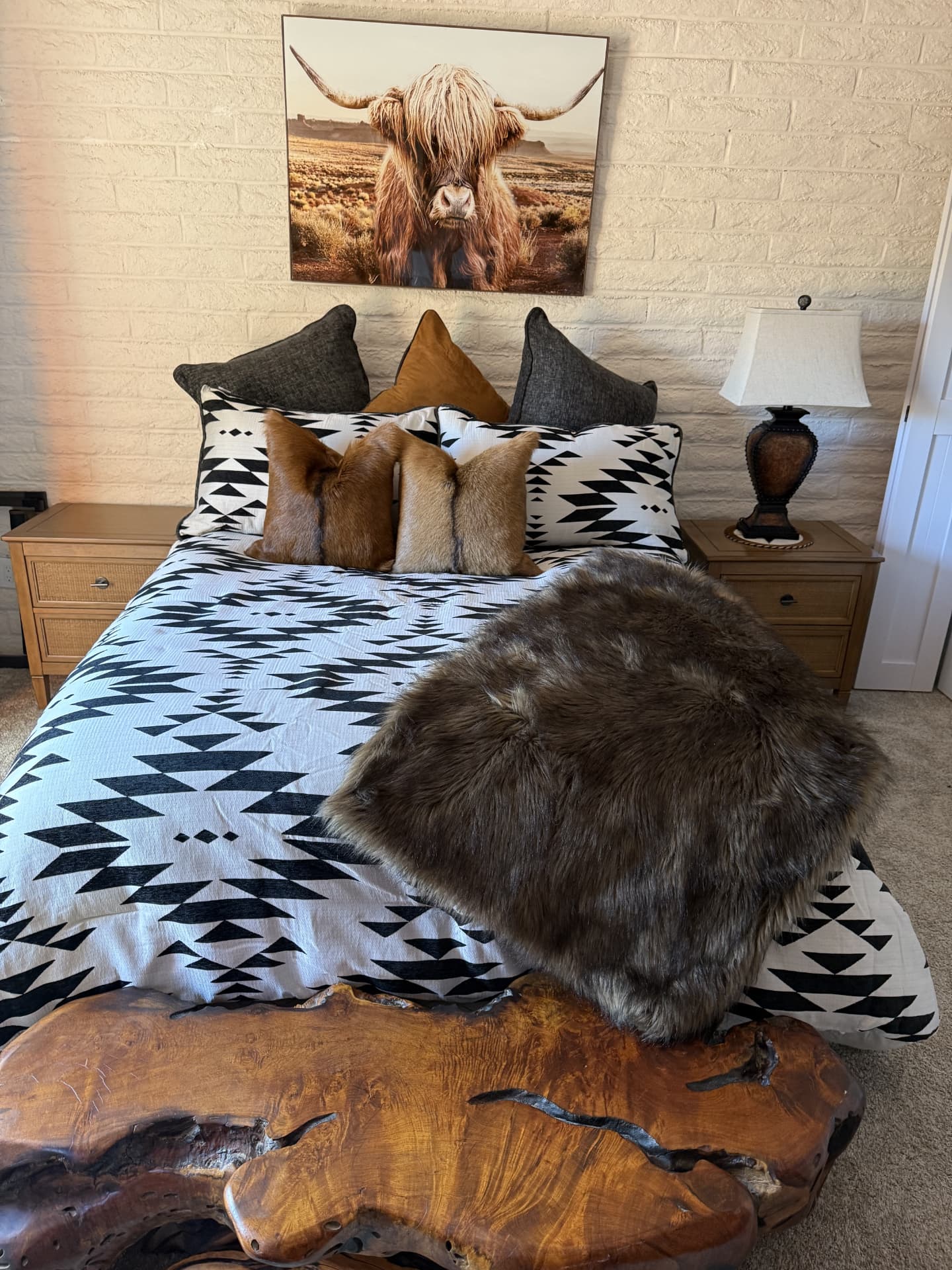 Tidy southwestern-style bedroom with patterned bedding and neatly arranged pillows